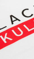 close up of black skullz logo on white tshirt